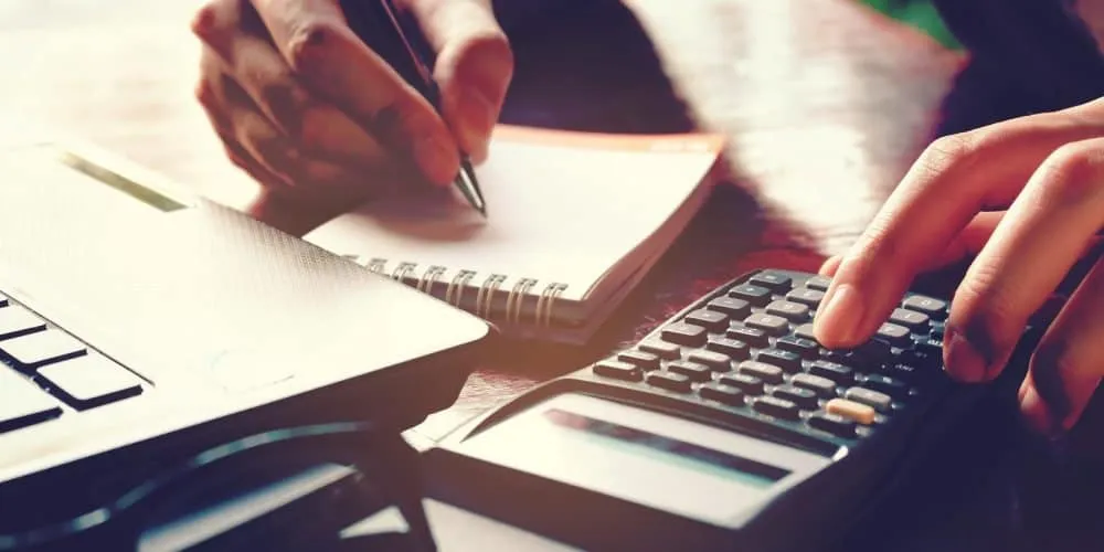 calculator and notepad and pen